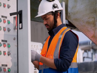 Male man white hardhat safety uniform Check the system electricity safety control cabinet box power system wire energy power system engineer factory work check note foreman job inspector site manager clipart