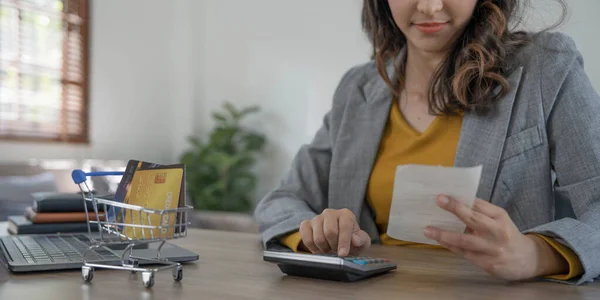 stock image Young asian woman calculating expenses household about finance and frustrated on desk at home, girl checking bill having stress and worried, debt and tax