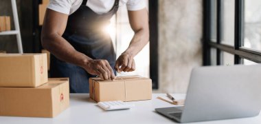 Start up small business entrepreneur SME or freelance asian man working with box at home concept, Young Asian small business owner, online marketing packaging box and delivery, SME concept..