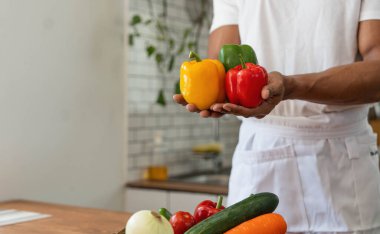 Portrait of young asian man making salad at home. cooking food and Lifestyle moment..