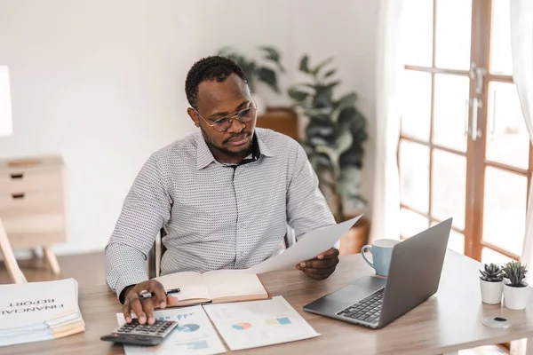 Stock image Portrait of handsome African black young business man working on laptop at office desk...