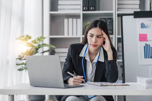 asian woman thinking hard concerned about online problem solution looking at laptop screen, worried serious asian businesswoman focused on solving difficult work computer task...