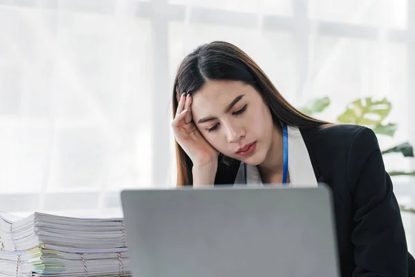 asian woman thinking hard concerned about online problem solution looking at laptop screen, worried serious asian businesswoman focused on solving difficult work computer task...