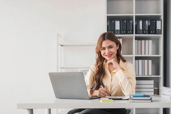 stock image Beautiful young teen asian business women holding computer laptop with hands up in winner is gesture, Happy to be successful celebrating achievement success..