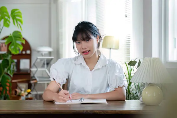 stock image Asian female student studying online, studying on a video call, zoom call, passionate Asian female teacher learning English online with a laptop computer.