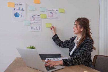 Portrait young businesswoman presentation marketing and profit with confident at office, investment and seminar for planning of finance, business woman standing explaining chart and graph..