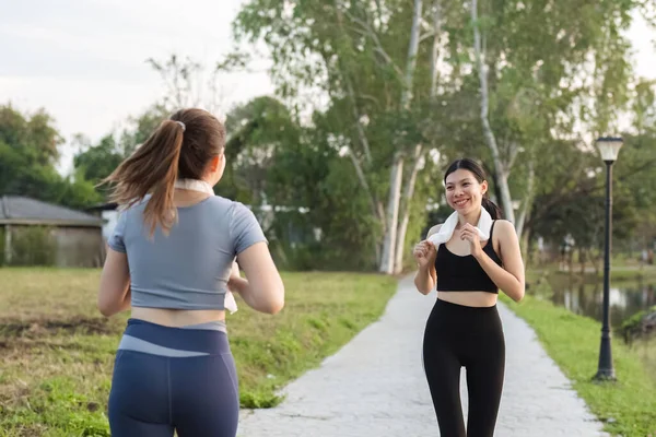 Beautiful Asian woman in sportswear is jogging or jogging in the park. To take care of your health and be strong.