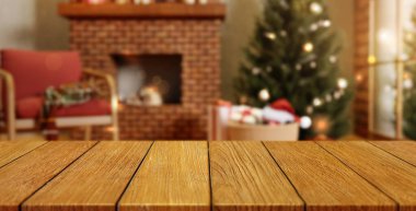 Yanmış şöminesi, dekore edilmiş bir Noel ağacı ve rahat bir koltuğu olan, neşeli ve davetkar bir atmosfer yaratan 3 boyutlu bir sunum..