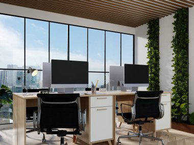 Bitkilerin, modern masaların ve açık hava atmosferinin yer aldığı zarif sürdürülebilir bir ofis..