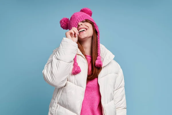 Playful Woman Winter Coat Pulling Her Funky Hat Yes While — Stock Photo, Image