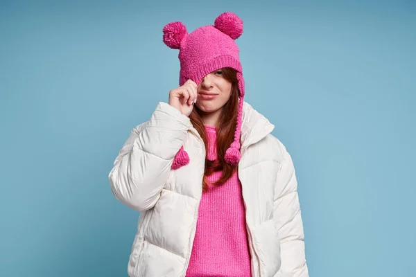 Displeased Young Woman Winter Coat Pulling Her Funky Hat While — Stock Photo, Image