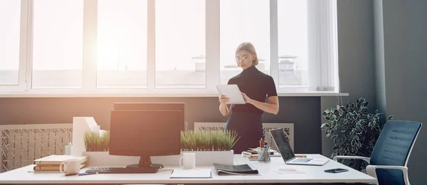 Concentrated Businesswoman Using Digital Tablet While Standing Window Office — Stock Photo, Image