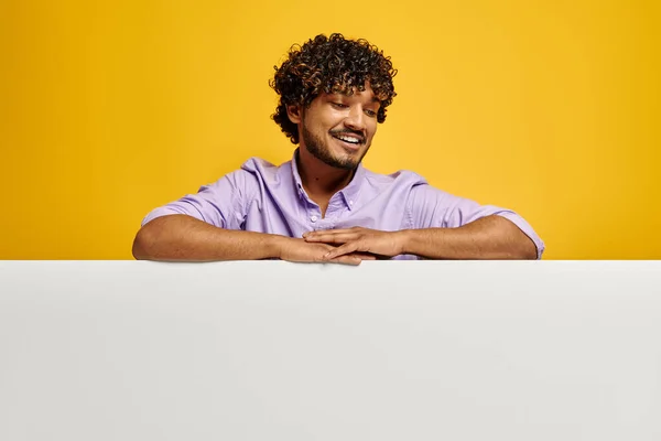 Handsome Indian Man Looking Copy Space Smiling Yellow Background — Stock Photo, Image