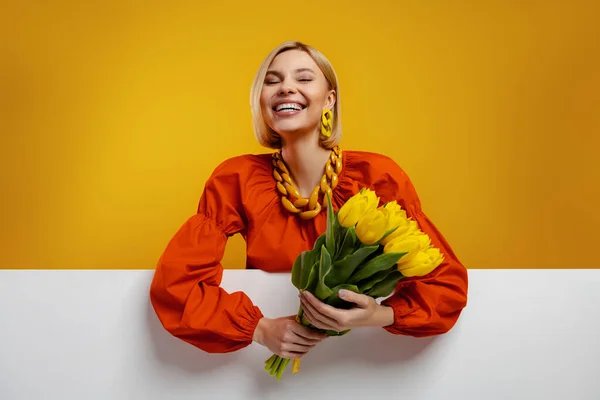 Excited Young Woman Holding Bunch Tulips Smiling Yellow Background — Stock Photo, Image