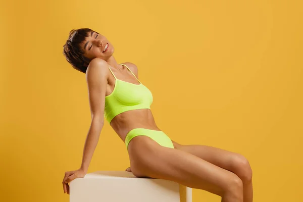 Relaxed Young Fit Woman Underwear Smiling While Sitting Yellow Background — Stock Photo, Image