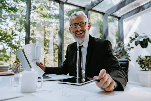 Confident Mature Businessman Doing Some Paperwork Smiling While Working Office — Stock Photo, Image