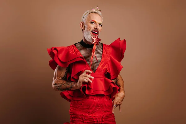 Playful Gay Man Beautiful Red Dress Holding Magic Wand Brown — Stock Photo, Image