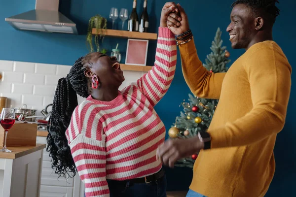 Beautiful Young African Couple Dancing Smiling While Celebrating Christmas Holiday — Stock Photo, Image