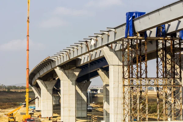 stock image Capture of a part of a highway under construction with scaffolding and crane.