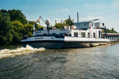 FRANKFURT, GERMANY -AUGUST 23, 2015 : German ferry transporting containers from Budapest on river Main in a sunny day 