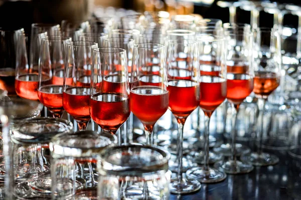 Strawberry wine in glasses ready for toasts at a wedding reception in Oregon.