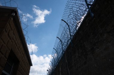 Prison security building. Boundary security wall. Prison for arrest criminals or terrorists. Private area. Military zone concept.