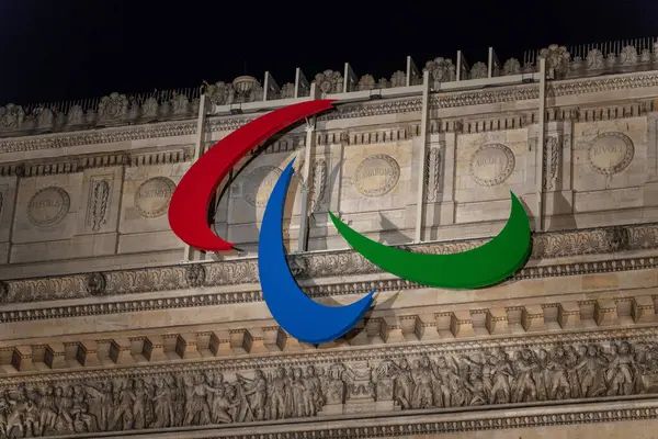 stock image Close-Up of Paralympic Games Logo on Arc de Triomphe at Night