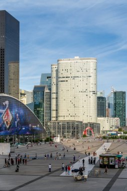 Paris, France - August 4, 2024: Coeur Defense building with CNIT Shopping mall in La Defense financial district in afternoon clipart