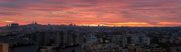 stock image Panoramic view of Paris skyline with sacre coeur in morning red sky with dramatic cloudscape