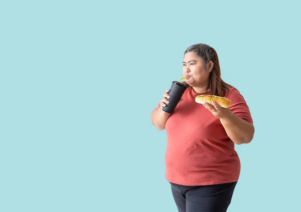 Asian Woman Fat Drinking Soda Holding Burger Isolated Blue Background — Stock Photo, Image