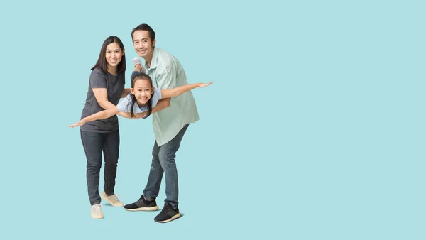 Happy asian family of father, mother and daughter hug spread out your arms, isolated on blue background with Clipping paths for design work empty free space