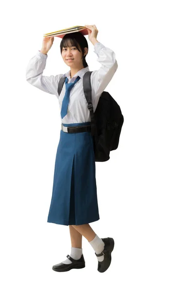 Щаслива Усміхнена Азіатська Студентка Уніформі Тримає Книги Голові Ізольований Фон — стокове фото
