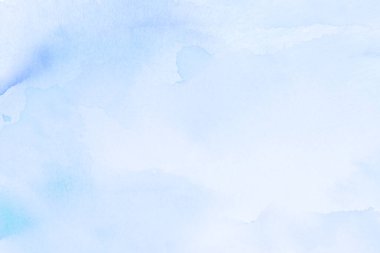 Suluboya kağıt dokusunda elle boyanmış mavi suluboya lekeler.