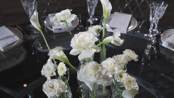 Stock video served tables in a restaurant with flower decoration