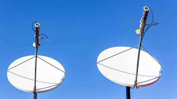 Satellite Dishes Digital Communication Two Units Close Blue Sky Remote Imagens De Bancos De Imagens