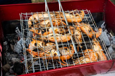 lobster in grill Burned on the charcoal stove, village style.