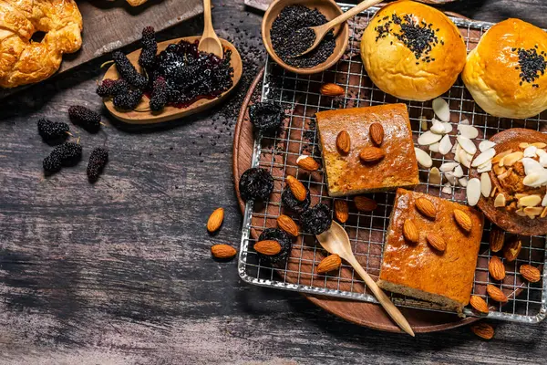 stock image Top view of bread and loaf with cereals bread and bakery, breadsticks on wooden table in dark background with copy space