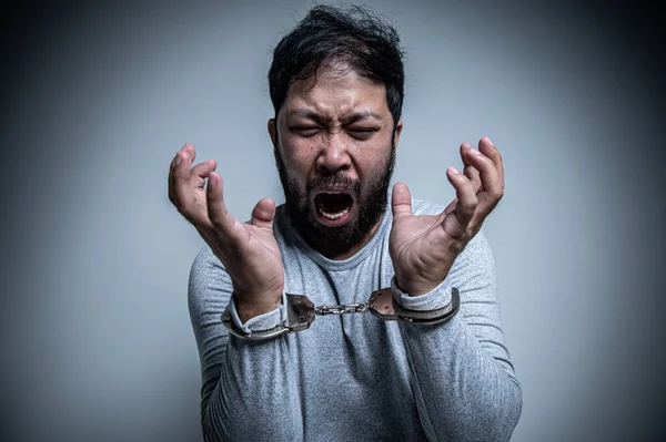 Asian handsome man angry on white background,Portrait of young Stress male concept,Bad mood after talking on the phone