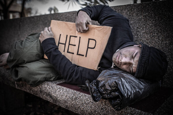 Asian man is homeless at the side road,A stranger has to live on the road alone because he has no family.
