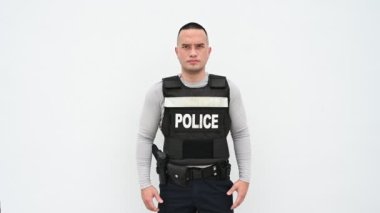 Portrait of police hold gun in hand on white background. Handsome asian cop