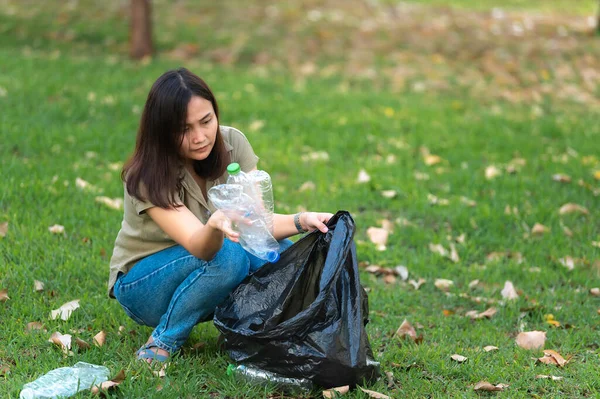 stock image Asian mother and daughter help garbage collection charity environment.