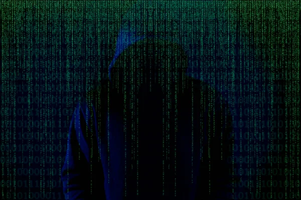 Asian hacker in black hood on black background,Hack password,hacking safety systems to steal information