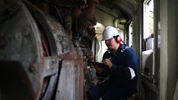 Engine Engineer Inspecting Large Machines Factory Railway Engine Maintenance Technician — Stock Video
