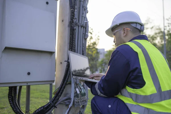 Telecommunication engineers work at cell towers for 5G cell phone signals,Network tower maintenance technicians