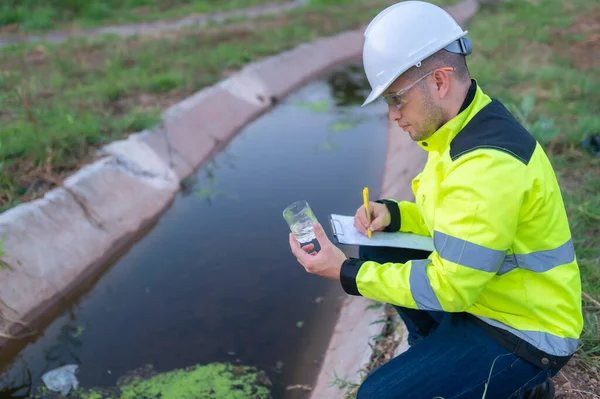 stock image Environmental engineers inspect water quality,Bring water to the lab for testing,Check the mineral content in water and soil,Check for contaminants in water sources.