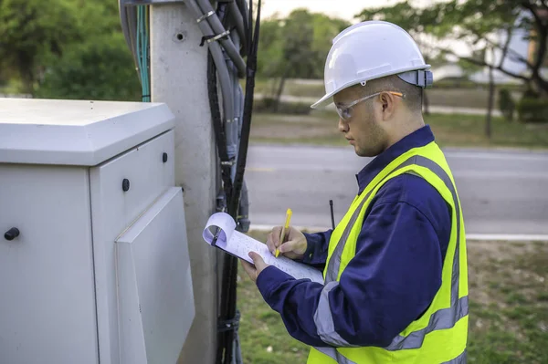 stock image Telecommunication engineers work at cell towers for 5G cell phone signals,Network tower maintenance technicians