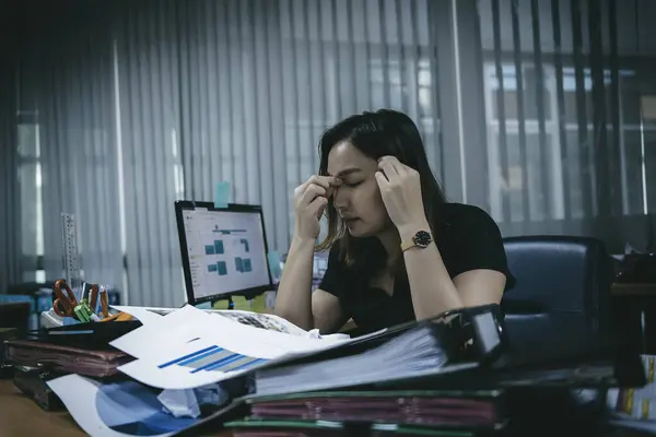 Asian office woman stress from work overload,She stressed because must send work At the specified time,Thailand people,Young secretary tired from boss about new project