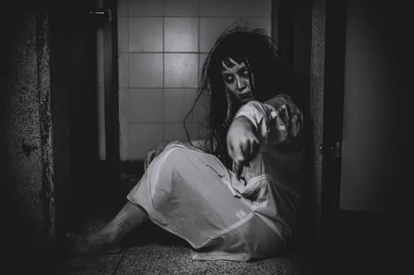 Portrait of asian woman make up ghost. Scary horror scene for background. Halloween festival concept. Ghost movies poster, angry spirit in the apartment