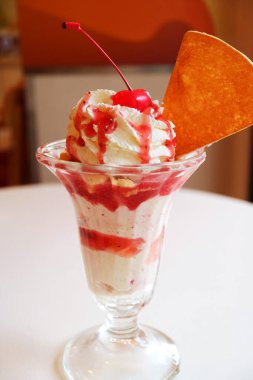 Mouthwatering Strawberry Ice Cream Sundae Served on White Table