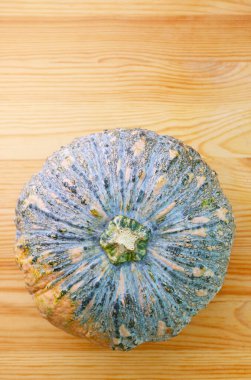 Top View of Fresh Ripe Thai Pumpkin or Squash Isolated on Wooden background